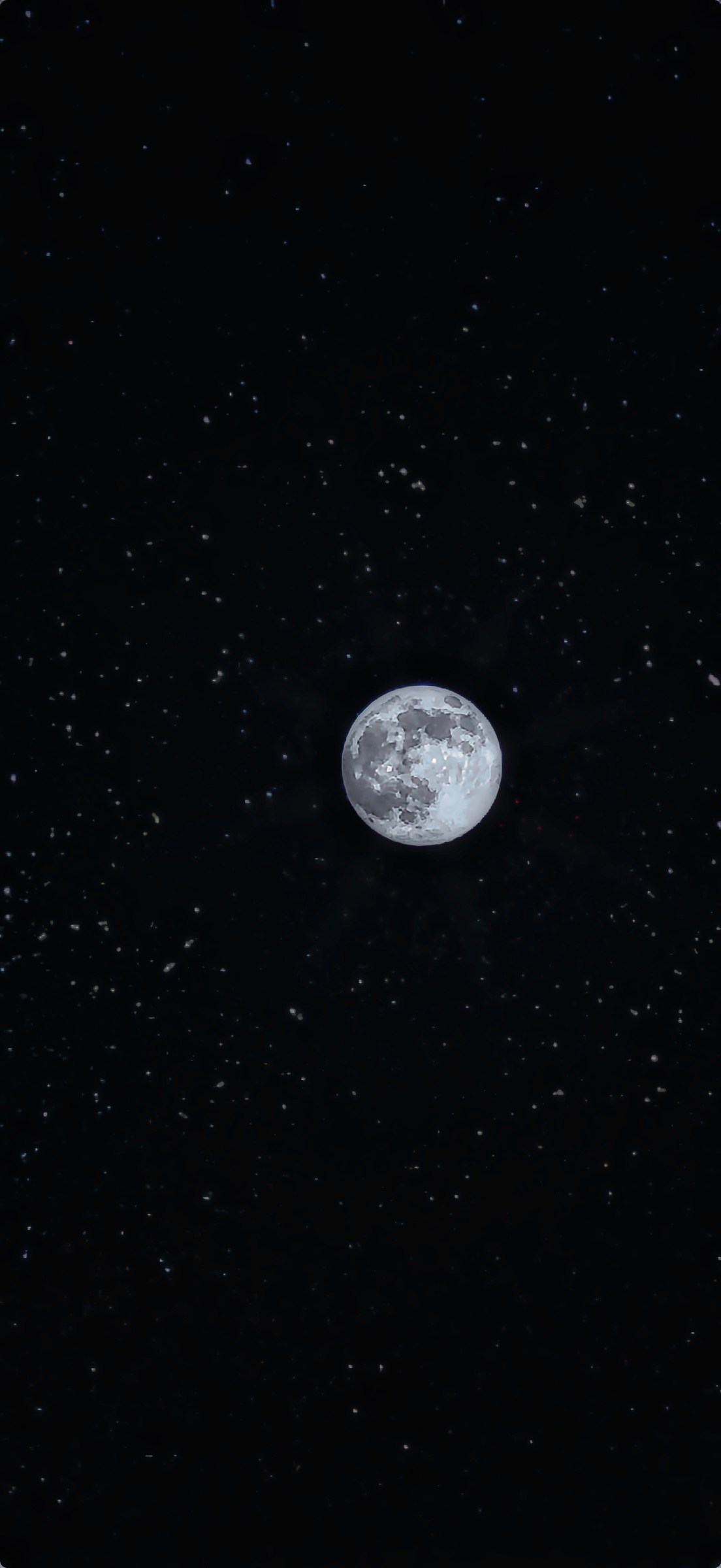 Detailed full moon surrounded by small faint stars against a black night sky.