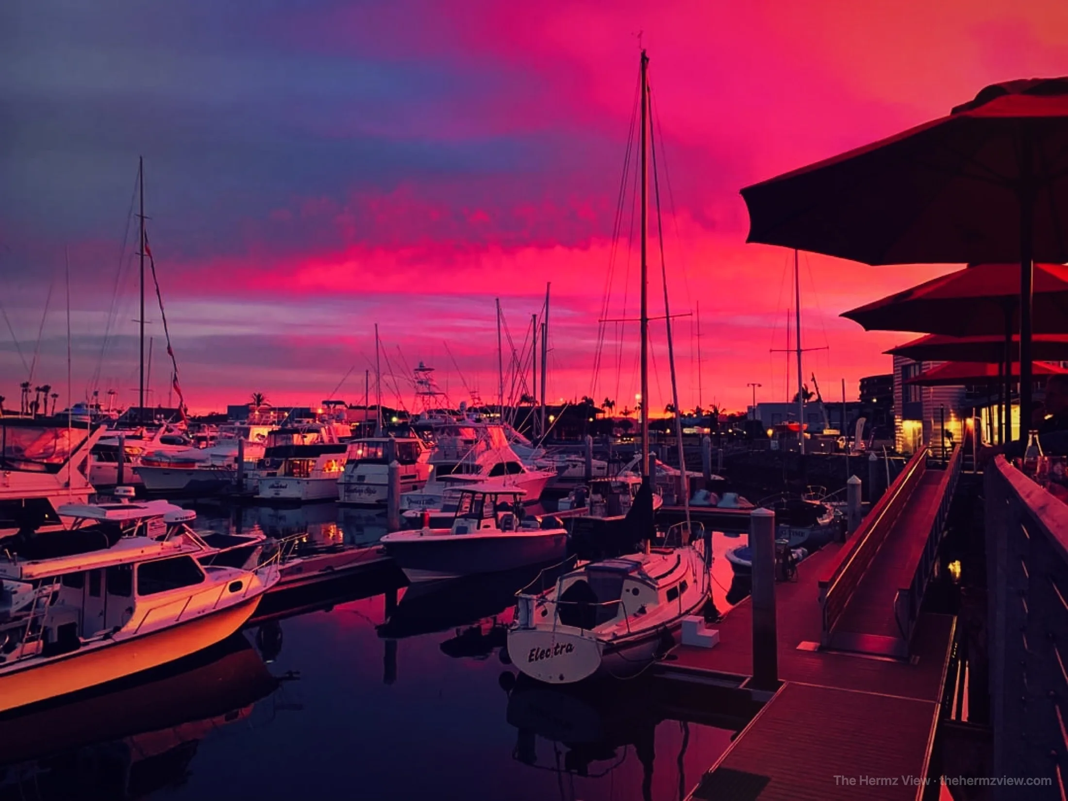 Marina lit up under an electric sunset