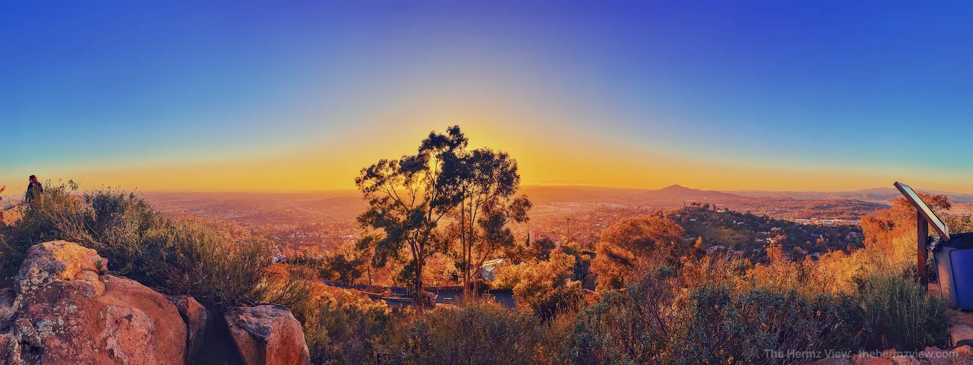 Golden evening light spreading across a desert landscape
