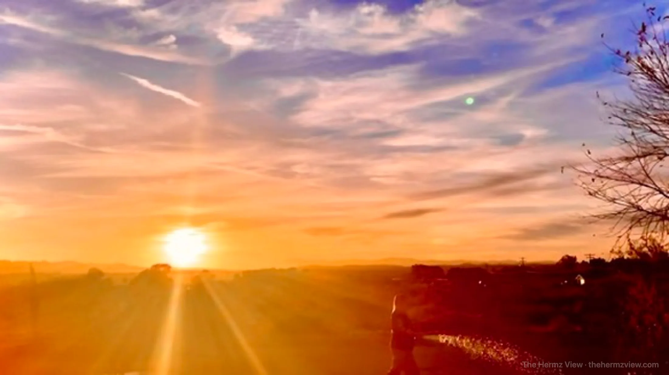 Sunburst breaking through a roadside horizon